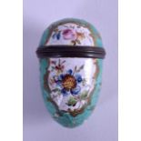 AN 18TH CENTURY ENGLISH ENAMEL BATTERSEA PILL BOX painted with flowers upon a green ground. 5.25