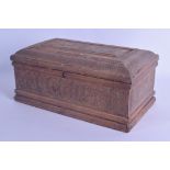 A 19TH CENTURY INDIAN KASHMIR CARVED SANDALWOOD CASKET AND COVER decorated all over with scrolling