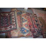 A GROUP OF FIVE PERSIAN RUGS, of various design. Largest 180 cm x 140 cm.