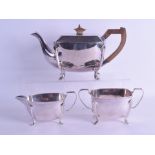 AN ART DECO SILVER PLATED THREE PIECE TEA SET. Largest 26.5 cm wide. (3)