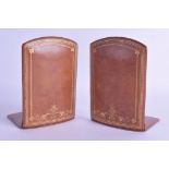 A RARE AND UNUSUAL PAIR OF LATE VICTORIAN FOLDING LEATHER BOOK ENDS with gilt scrolling tooling.