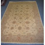 A 20TH CENTURY MUTED WOOL OUSHAK/ZIEGLER RUG, decorated with foliage. 221 cm x 155 cm.