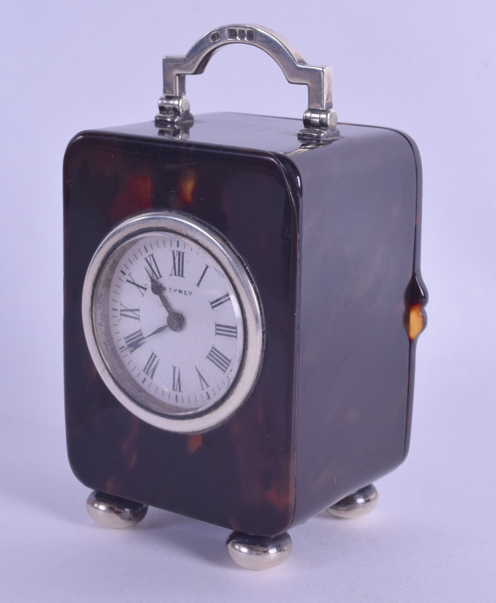 A LOVELY EDWARDIAN SILVER AND TORTOISESHELL ASPREY CARRIAGE CLOCK with circular enamel dial and