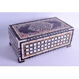 AN UNUSUAL TURKISH OTTOMAN CARVED BONE TORTOISESHELL AND MOTHER OF PEARL CASKET with sliding top,