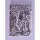 AN EDWARDIAN SILVER CARD CASE by Henry Matthews, decorated with figures playing instruments within