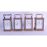 A GROUP OF FOUR EARLY 20TH CENTURY FRENCH BRASS CARRIAGE CLOCKS with white enamel dials and black