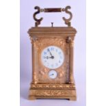 A FINE LARGE FRENCH GILT BRONZE ART NOUVEAU REPEATER CARRIAGE CLOCK with two dials flanked by relief