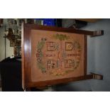 AN ANTIQUE EMBROIDERED WOODEN FIRESCREEN. 79 cm x 54 cm.