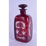 A BOHEMIAN RUBY GLASS DECANTER AND STOPPER engraved with landscapes and animals. 22.5 cm high.