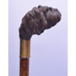 A LATE 19TH CENTURY BAVARIAN BLACK FOREST HANDLED WALKING CANE in the form of a hounds head. 81 cm