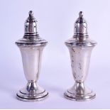 A PAIR OF REED AND BARTON STERLING SILVER CONDIMENTS. 8.6 oz. (weighted). 11.5 cm high.