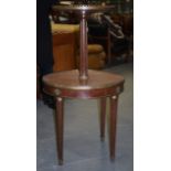 AN ANTIQUE TWO TIER MAHOGANY TABLE, with top marble panel. 112 cm x 81 cm.