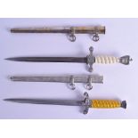 TWO GERMAN MILITARY DAGGERS both with spirally twisted handles, one with eagle terminal, one with