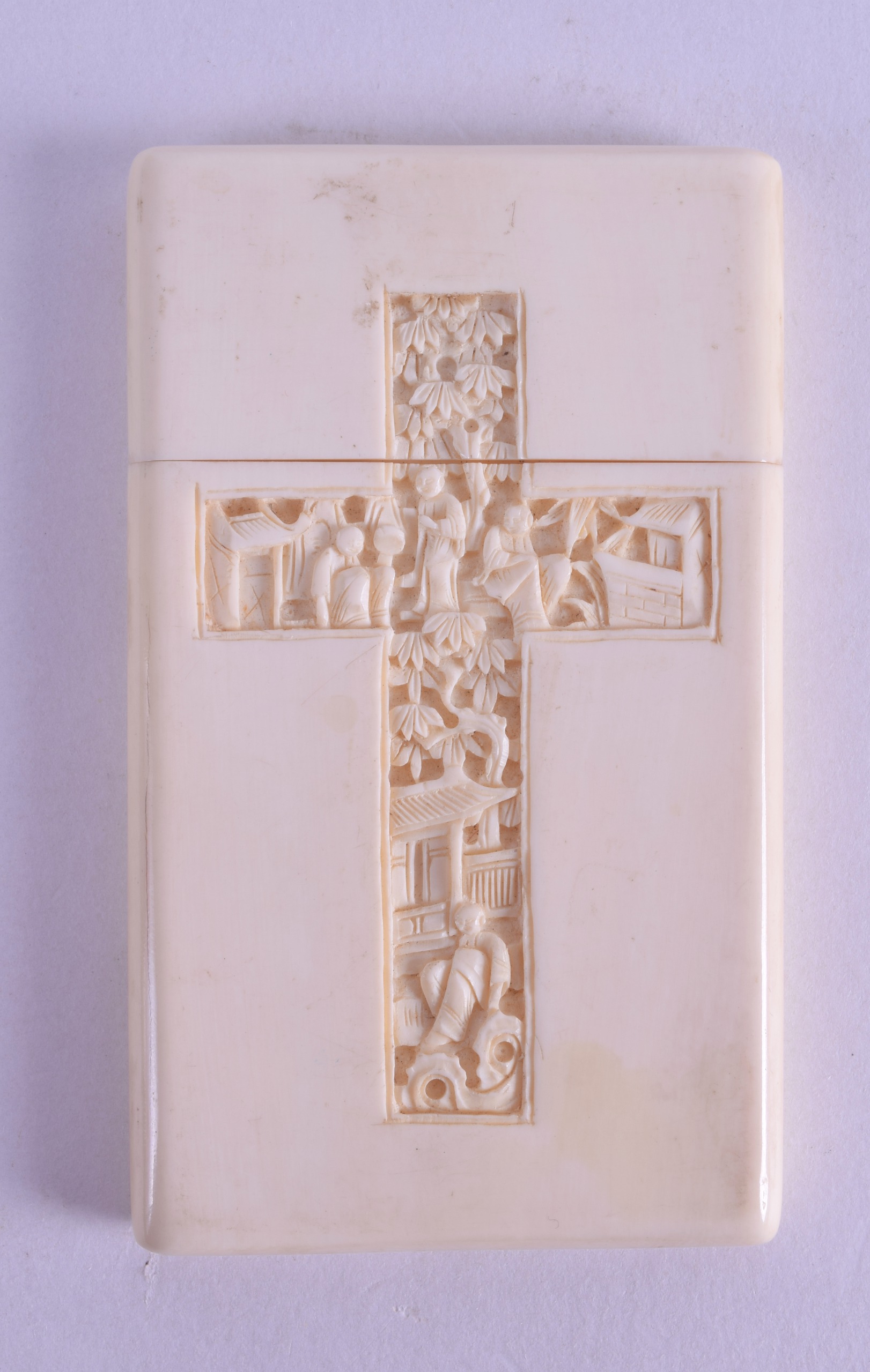 A 19TH CENTURY CHINESE CANTON CARVED IVORY CARD CASE decorated with figures within a crucifix. 5.5