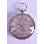 AN ANTIQUE SILVER POCKET WATCH with silvered dial and scrolling floral motifs. 5 cm diameter.