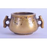 A MINIATURE CHINESE TWIN HANDLED BRONZE CENSER. 329 grams. 8.5 cm wide, internal diameter 4 cm.