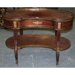 A GOOD EMPIRE STYLE KIDNEY SHAPED DESK, with ormolu mounts. 71 cm x 107 cm wide.