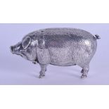 A FINE AND RARE EDWARDIAN NOVELTY VESTA CASE in the form of a pig, the head rising to reveal a