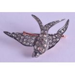 A ROSE GOLD SILVER AND DIAMOND SWALLOW BROOCH. 8.5 grams. 4.5 cm wide.