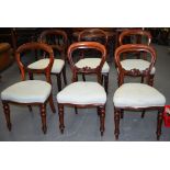 A SET OF SIX VICTORIAN MAHOGANY BALOON BACK CHAIRS.