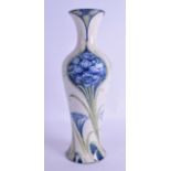 AN ART NOUVEAU MOORCROFT FLORIANWARE BALUSTER VASE painted with flowers. 30.5 cm high.