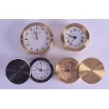FOUR TIFFANY & CO BRASS TRAVELLING CLOCKS in various forms and sizes. Largest 7 cm diameter. (4)