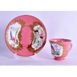 AN 18TH/19TH CENTURY SEVRES PORCELAIN TEA CUP AND SAUCER painted with fancy birds upon a rich pink