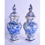 A PAIR OF 19TH CENTURY DELFT FAIENCE TIN GLAZED VASES AND COVERS painted with figures on horseback