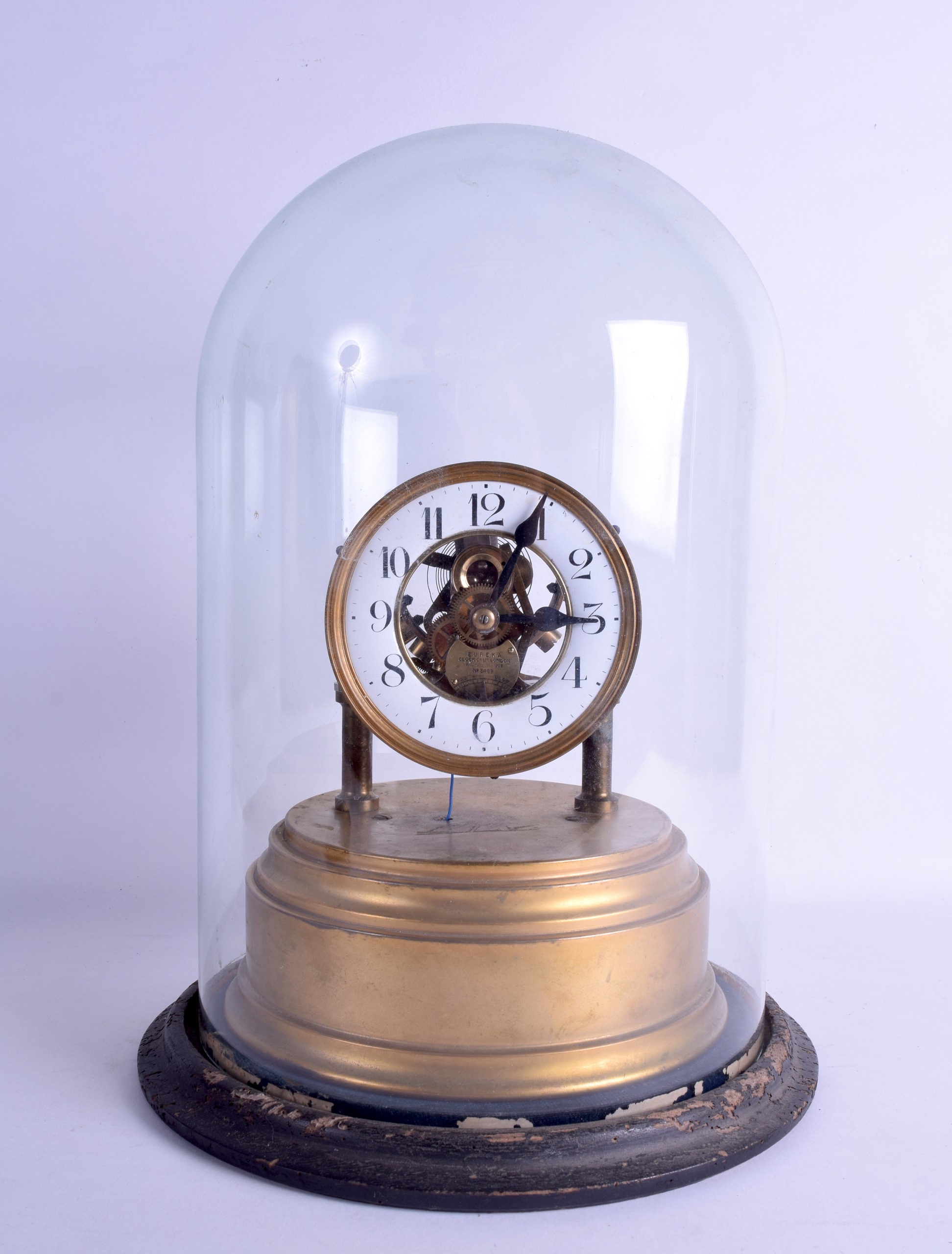 A RARE EUREKA CLOCK CO LONDON ATMOSPHERIC TYPE MANTEL CLOCK within a glass dome, number 3469, with
