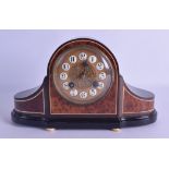 A LATE VICTORIAN/EDWARDIAN EBONY AND WALNUT MANTEL CLOCK of scrolling form with gilt metal dial.