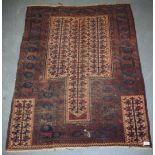 A 19TH CENTURY BALUCH CAMEL FIELD PRAYER RUG, decorated with motifs. 130 cm x 100 cm.