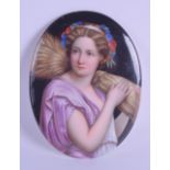 A LATE 19TH CENTURY EUROPEAN PAINTED PORCELAIN PLAQUE depicting a female holding a sheath of corn.