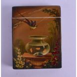 A VICTORIAN PAINTED PAPIER MACHE CARD CASE painted with a parrot in flight over a gold fish bowl.