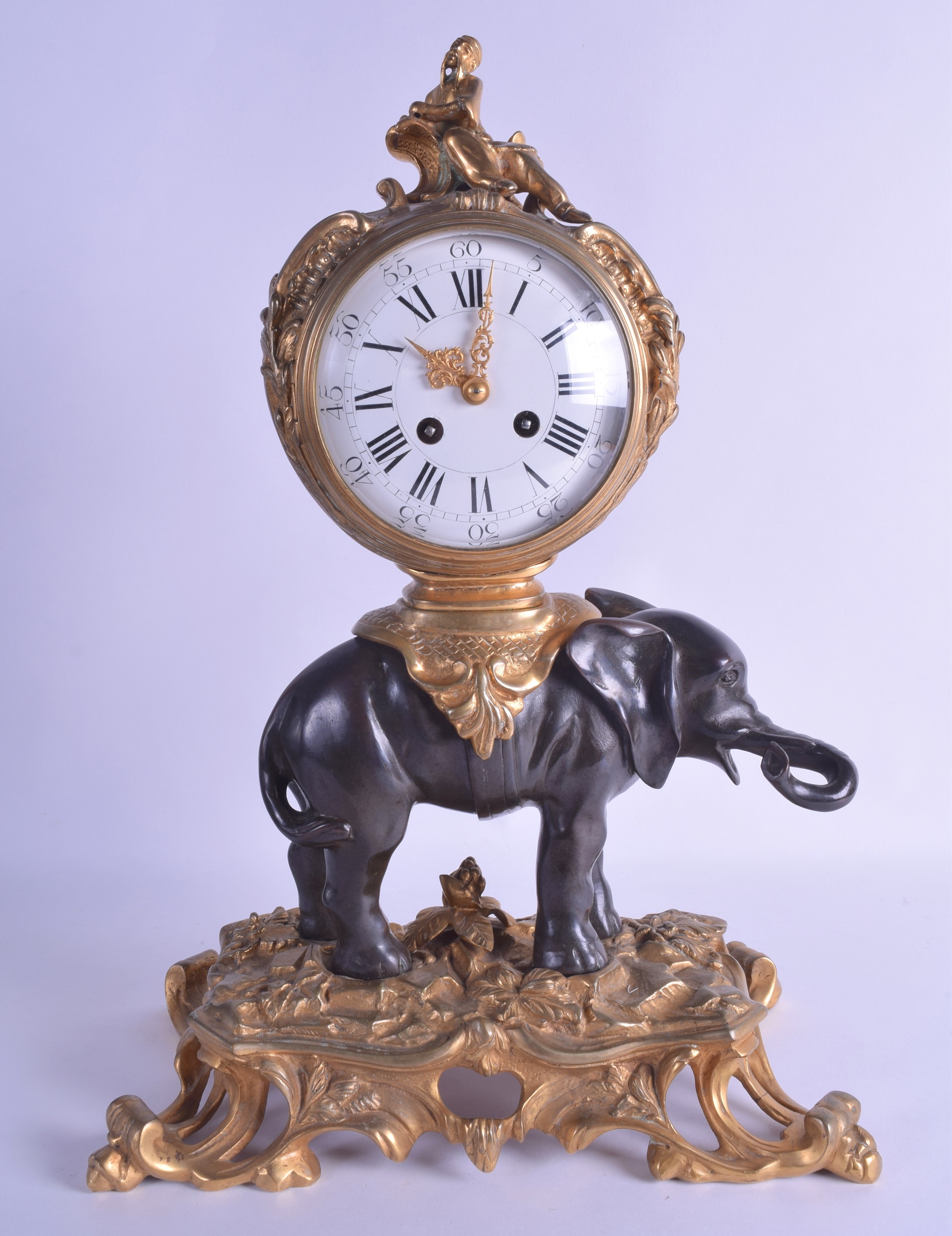 A GOOD 19TH CENTURY FRENCH ORMOLU AND BRONZE MANTEL CLOCK modelled as a standing elephant with a