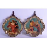 AN UNUSUAL PAIR OF 19TH CENTURY ITALIAN PAINTED TIN ICONS contained within brass frames, depicting