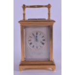 AN ANTIQUE FRENCH GLASS REPEATING CARRIAGE CLOCK with silvered dial and black numerals. 19.25 cm