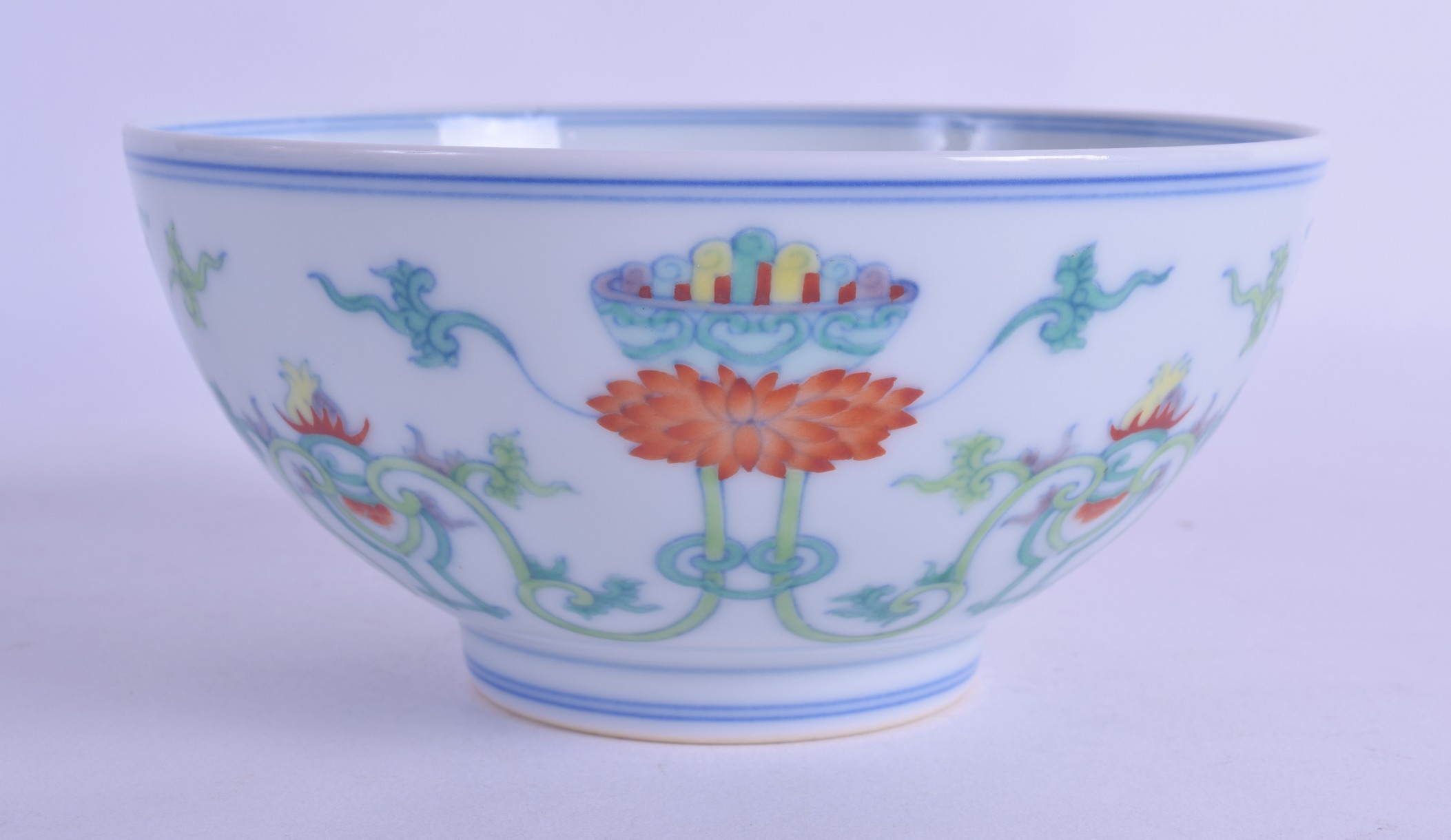A CHINESE DOUCAI PORCELAIN CIRCULAR BOWL bearing Qianlong marks to base, painted with flowers and