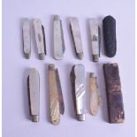 A GROUP OF NINE SILVER AND MOTHER OF PEARL FRUIT KNIVES of various designs and sizes. (9)