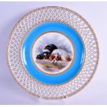 Late 19th c. Minton fine plate painted with black and white spaniels under a turquoise and pierced