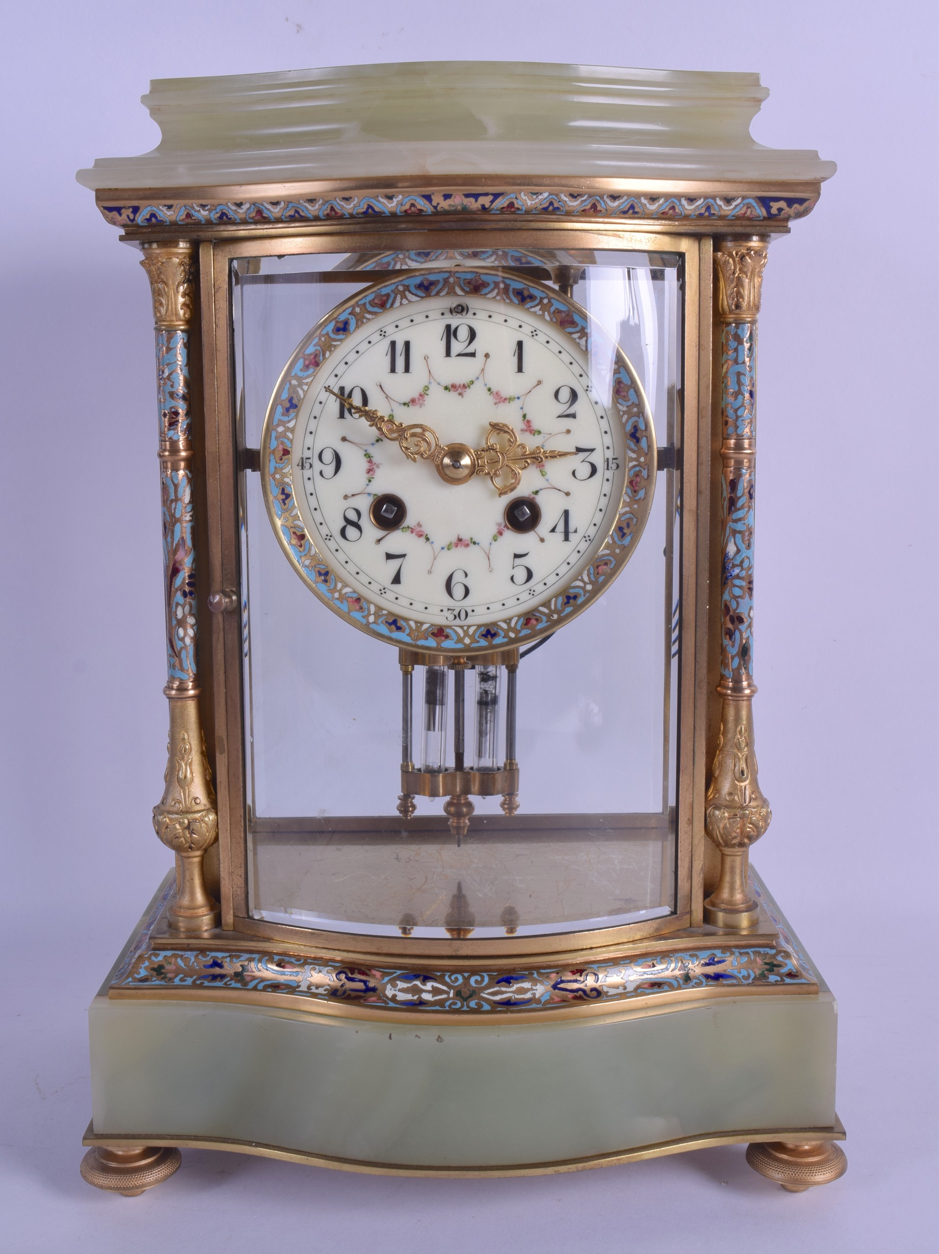 A LATE 19TH CENTURY FRENCH ONYX CHAMPLEVE ENAMEL AND ORMOLU MANTEL CLOCK of shaped form, decorated