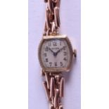 A VINTAGE 9CT GOLD ROLEX WRISTWATCH with rose metal expanding strap. 19.3 grams. 2 cm wide.