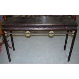 AN UNSUAL EARLY 20TH CENTURY CHINESE CARVED HARDWOOD ALTER TABLE inset with hardstone discs.