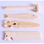 A COLLECTION OF 19TH CENTURY CARVED IVORY TOOLS including a saw & hammer. (4)