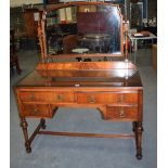 AN ANTIQUE MAHOGANY DRESSING TABLE, with brass handles. 158 cm x 120 cm.