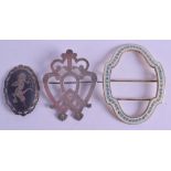 A VINTAGE SILVER AND ENAMEL BELT BUCKLE together with two other silver brooches. (3)