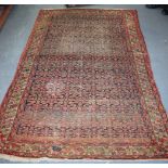 AN ANTIQUE SENNAH RUG, decorated with motifs. 200 cm x 131 cm.