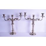 A LARGE PAIR OF MID 19TH CENTURY SILVER PLATED TWIN BRANCH CANDLEABRA decorated with overlaid