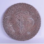 A 19TH CENTURY MIDDLE EASTERN SILVER INLAID COPPER DISH decorated with calligraphy and vines. 24.5