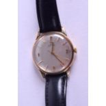 A 1960S 9CT GOLD OMEGA AUTOMATIC WRISTWATCH with silvered dial. 32 grams overall. 3.25 cm diameter.