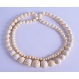 A LATE 19TH CENTURY EUROPEAN CARVED IVORY NECKLACE. 108 cm long. 86 cm long.